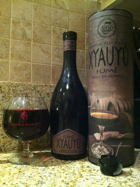 A barleywine, that is flat, that is corked, that is capped, that is waxed, that is in a circle box: Xyauyuception