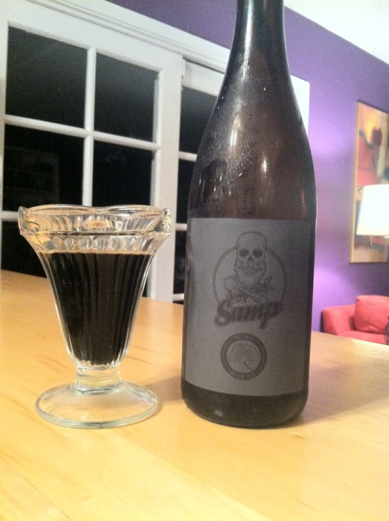 The label is dark and metal, the beer is straight Nescafe RIS